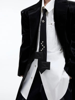 The adjustable neck strap and buckle of the streetwear tie