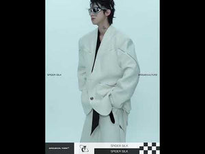 Video showing 360 degree view of no collar streetwear blazer highlighting metal zipper details and premium construction