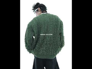 Video showing how the diamond accents catch light when moving in this deconstructed cardigan