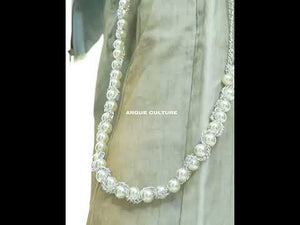 Video demonstration of the detachable pearl chains and vintage wash on these flared streetwear jeans