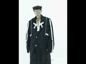 Video showing the movement and styling of this deconstructed wool trench coat with asymmetrical slits