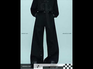 Video demonstration showing how these metal-trim wide-leg trousers move and fit on the body