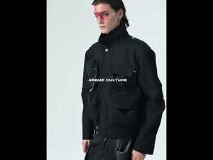 Video demonstration of the jacket's pockets, folded sleeves, and deconstructed design elements in motion