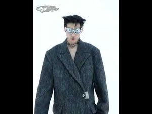 Video showcasing the oversized trench coat's industrial punk aesthetic and minimalist sophistication in motion