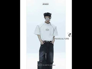 Video showing the avant-garde white zip-up tee in motion, highlighting its sculpted fit and edgy street style details