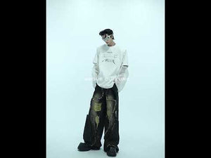 Video demonstration showing how to style this unique mesh-sleeve deconstructed tee for urban streetwear looks