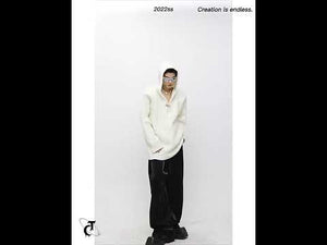 Video showcasing oversized hooded knit sweater in motion with streetwear styling tips