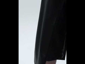 Video demonstration of deconstructed leather shorts being styled for urban summer streetwear looks