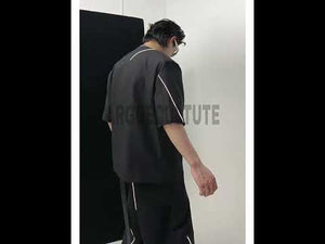 360-degree video showcasing the asymmetrical V-neck blazer set with padded shoulders and reflective details