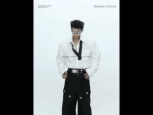 Video showcasing the versatile oversized shirt with detachable satin tie and unique double cuff design