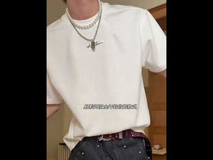 Video showcasing different ways to style the oversized boxy fit t-shirt for urban streetwear looks