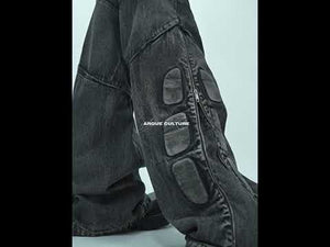 360-degree video showcase of cyberpunk-style distressed black jeans with PU leather panel construction