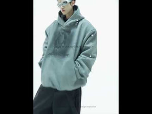 Video showing 360-degree view of pearl-accented oversized hoodie being worn and styled