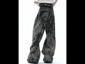 360-degree video showcase of distressed ink-splashed flare jeans highlighting all design details