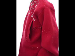 360-degree video showcasing the sparkling diamond details and loose fit of this premium wool cardigan