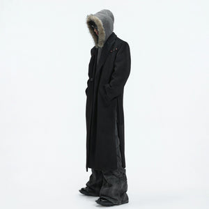 Side view showing the structured padded shoulders and loose fit silhouette