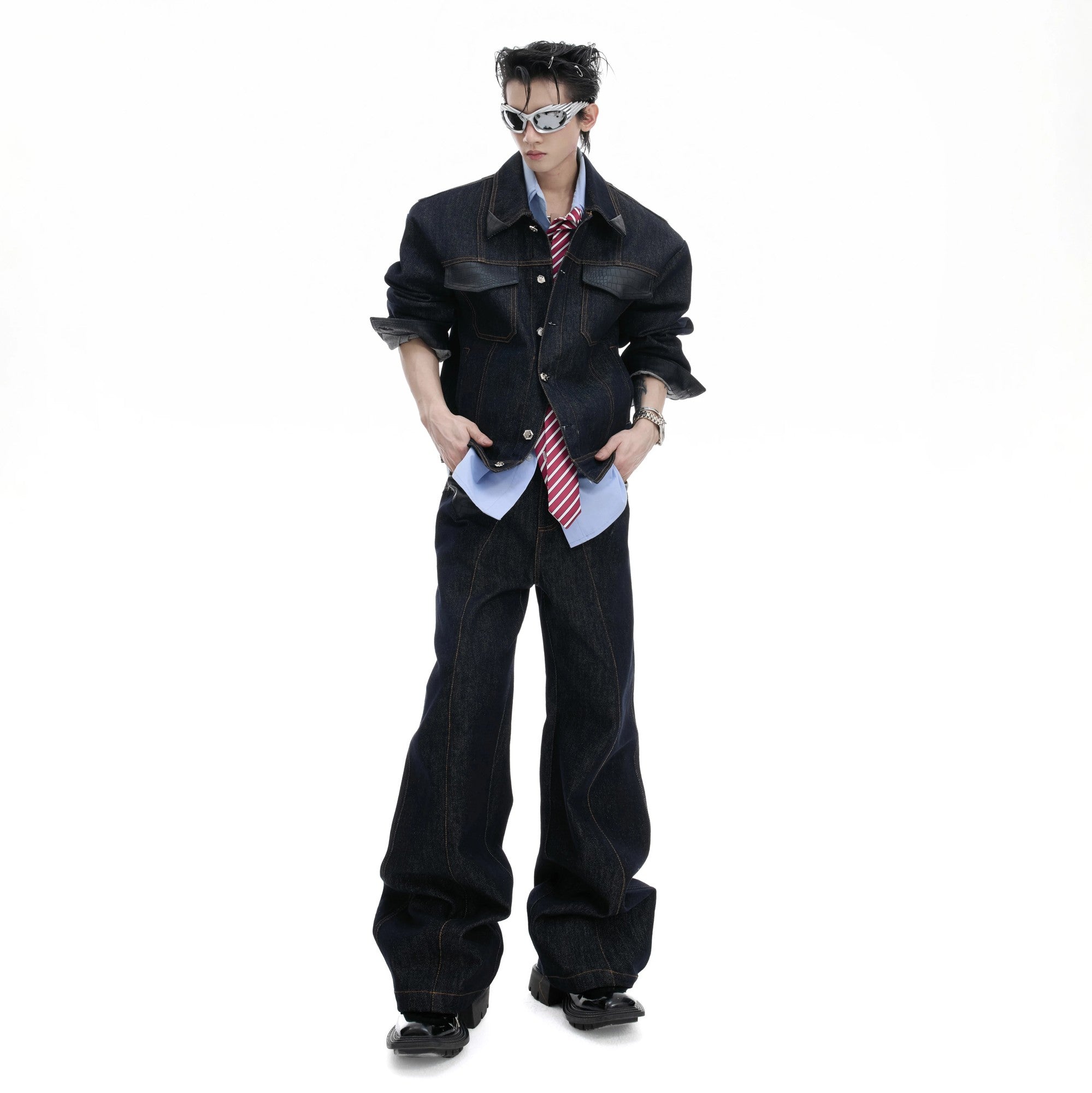 Model wearing full raw denim set with short jacket and matching pants.