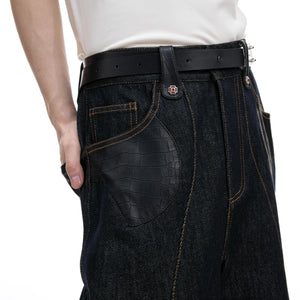 Detail view of the matching raw indigo denim pants with premium stitching.