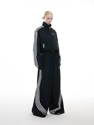 Red streetwear tracksuit with white 4-stripe speed line detailing