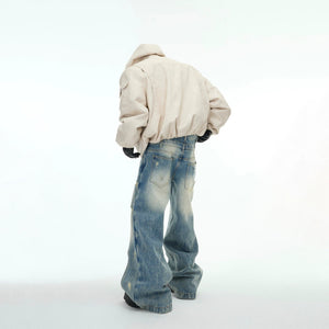 Back view of deconstructed distressed reversible puffer coat