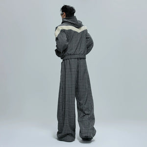 Model wearing the full reversible houndstooth streetwear tracksuit
