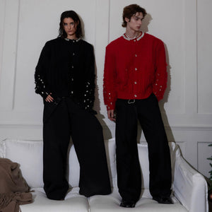 Back view of a red oversized knit cardigan showing the loose silhouette.