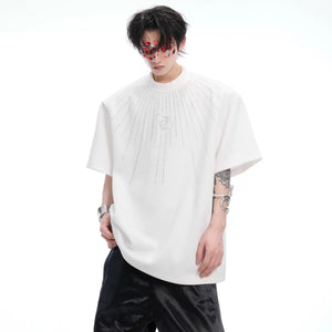 Close-up of high-quality rhinestones on a gray cotton oversized shirt