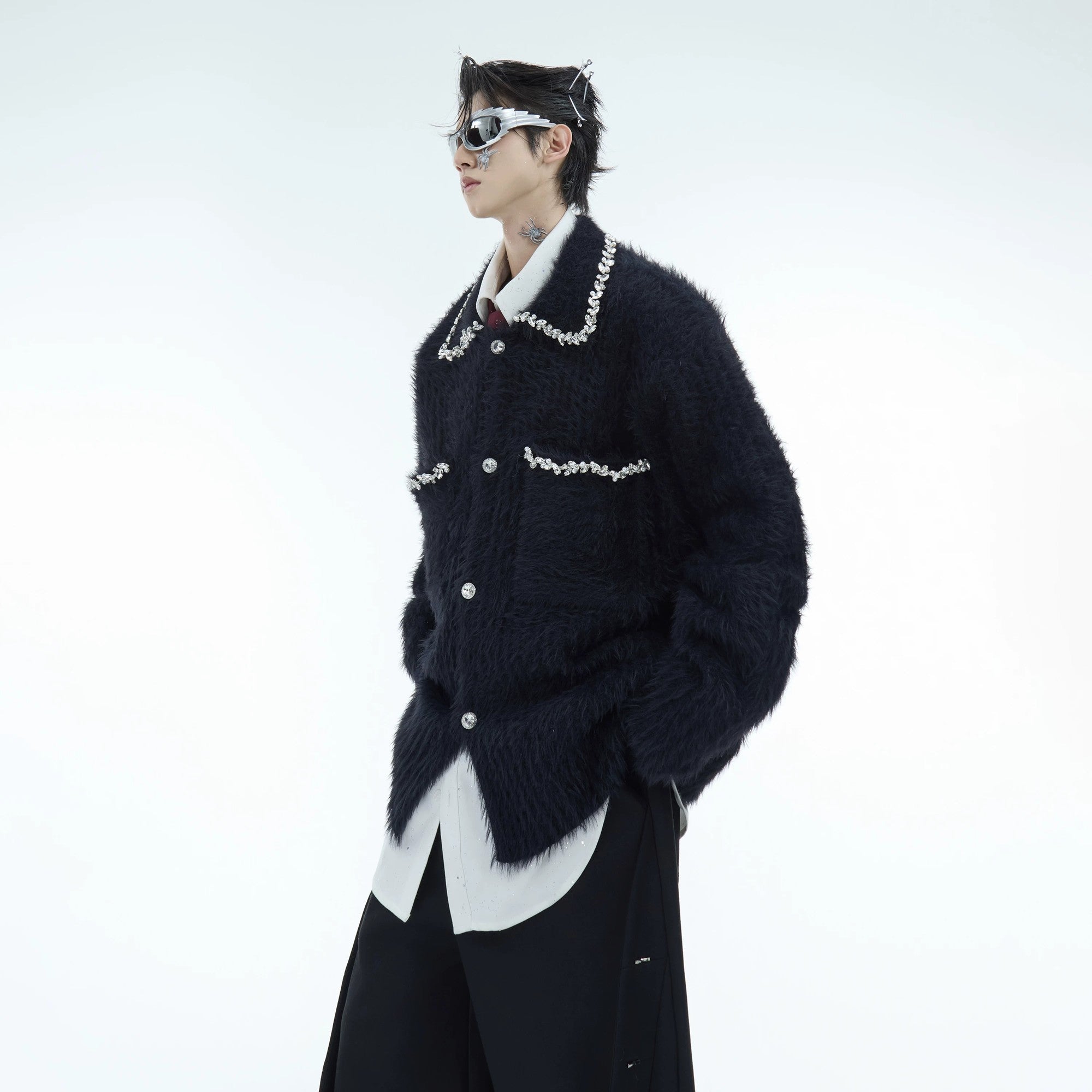 Model wearing white oversized spliced mohair cardigan in a street setting.