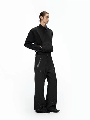 Model wearing rhinestone flared pants with chunky sneakers