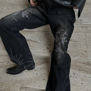 Close up of rhinestone detailing and deconstructed patchwork design