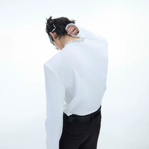 Model showing the structured silhouette with removable shoulder pads