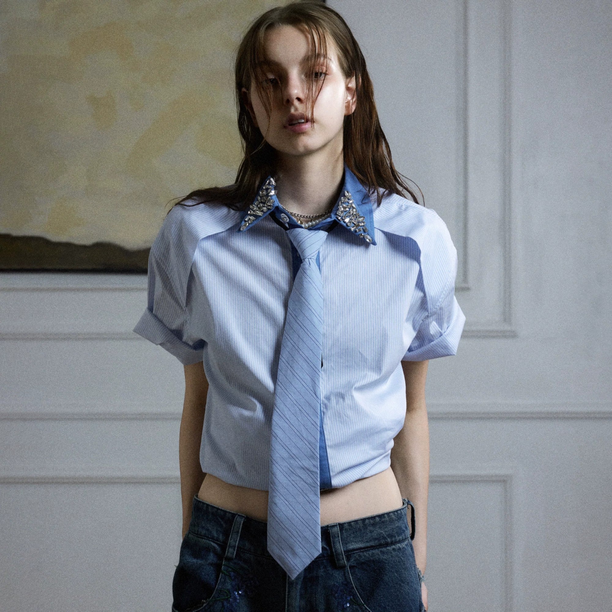 Loose fit deconstructed striped short sleeve shirt back view.