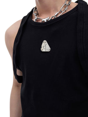 Close-up of the signature metal logo on ribbed texture fabric