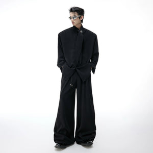 Close up of the ribbed fabric and drape on wide-leg trousers