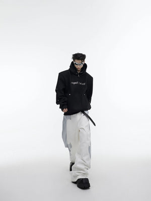 Streetwear hoodie featuring modular detachable shoulder pad design