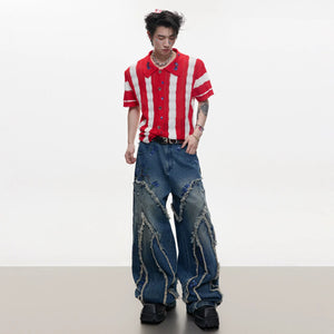 Model wearing sequin wide-leg jeans with sneakers in an urban setting.