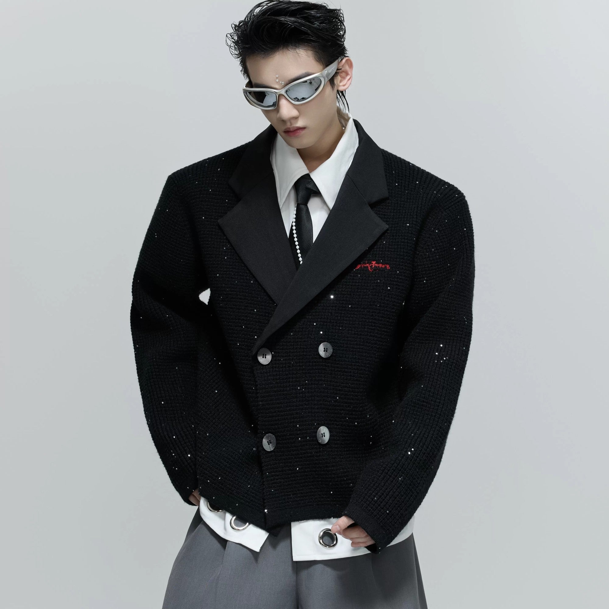 Close-up detail of the subtle sequins on the textured wool blend fabric.