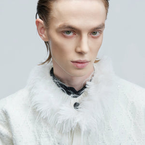 Close up of rabbit hair blend fabric and amber buttons on knitwear