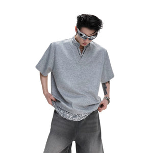 Close up of silver sequin patchwork detail on black t-shirt