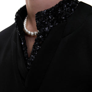 Model wearing silver gray loose fit sequin patchwork tee