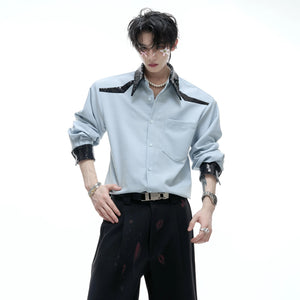 Close-up of structured shoulder pads and sequin collar detail