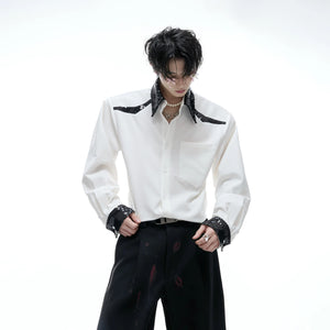 Detail shot of shimmering sequin embroidery on shirt cuffs