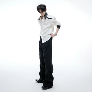 Model wearing blue sequin shirt in a urban street setting