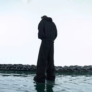 Close-up detail of the deconstructed plush hoodie with shimmer finish