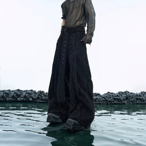 Model wearing the oversized shimmer tracksuit in an urban setting