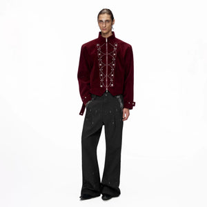 Model wearing the red shimmer sequin jacket in a street setting