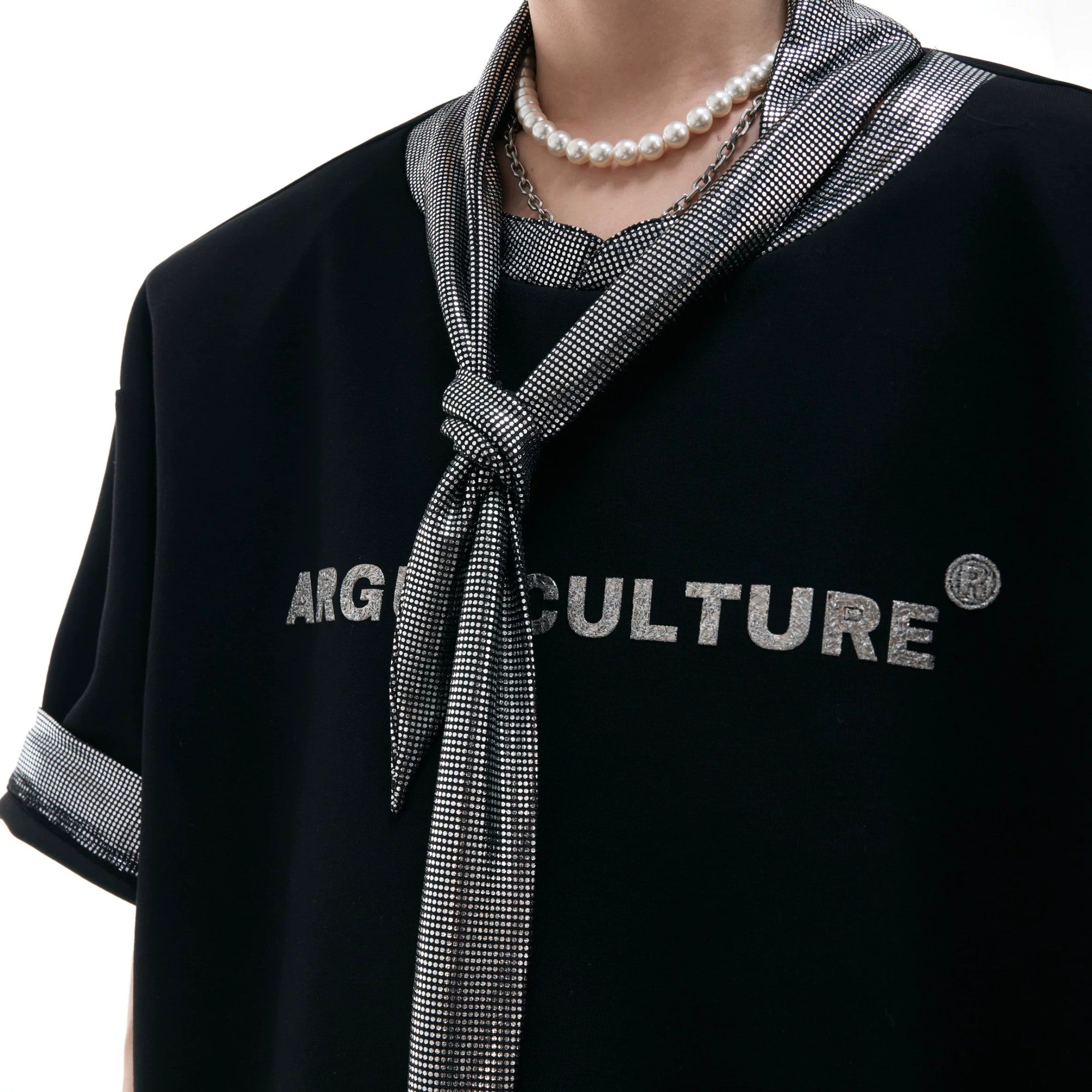 Gray loose fit graphic tee featuring niche metallic ribbon neck design.