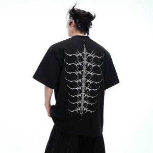 Front view of white oversized cotton T-shirt with designer metallic logo