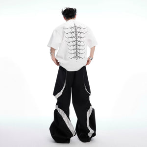 Red oversized embroidered T-shirt styled with baggy jeans for street look