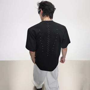 Model wearing the Gray Snake Eye Spine Studded T-shirt streetwear style
